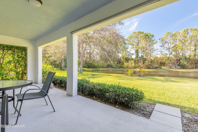 view of patio / terrace with a water view