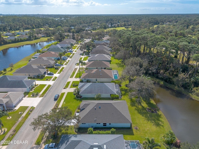 drone / aerial view with a water view