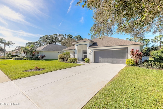 ranch-style home with driveway, an attached garage, a front lawn, and stucco siding