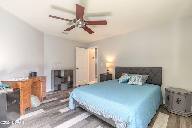 bedroom featuring ceiling fan and wood-type flooring