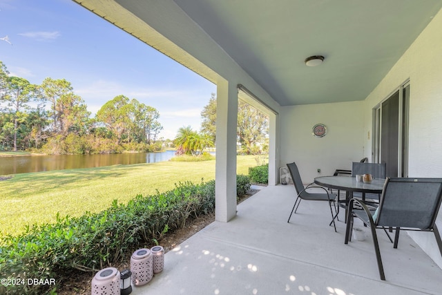 view of patio with a water view