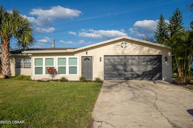 ranch-style home with a garage and a front lawn