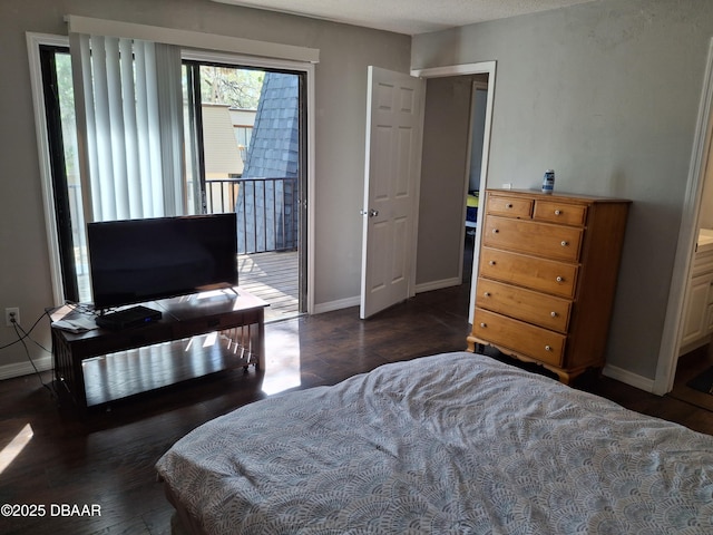 bedroom featuring access to outside, dark wood-type flooring, and baseboards