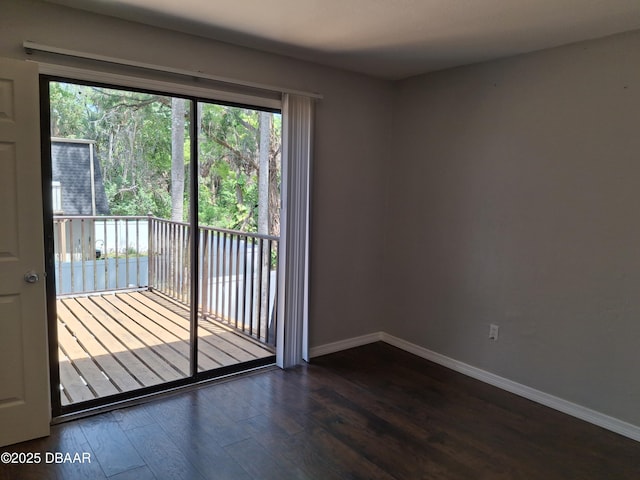 entryway featuring dark wood finished floors and baseboards