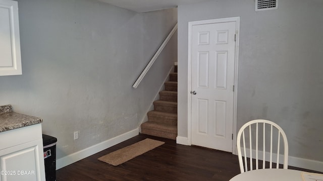 81 Springwood Sq, Port Orange, FL 32129 - dining area with dark wood-style floors, stairs, and baseboards