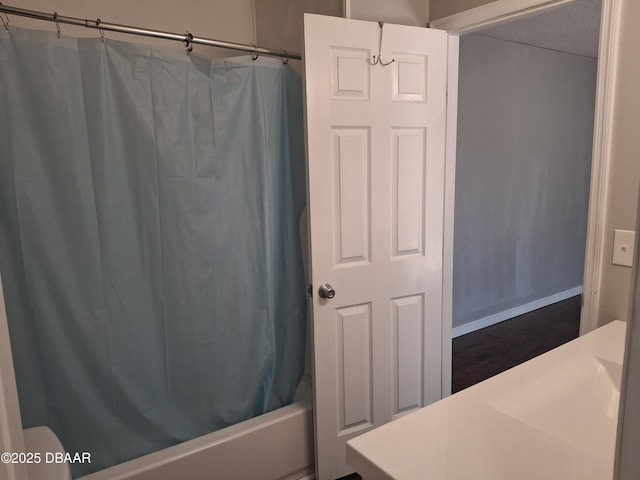 81 Springwood Sq, Port Orange, FL 32129 - bathroom featuring shower / bath combo and baseboards