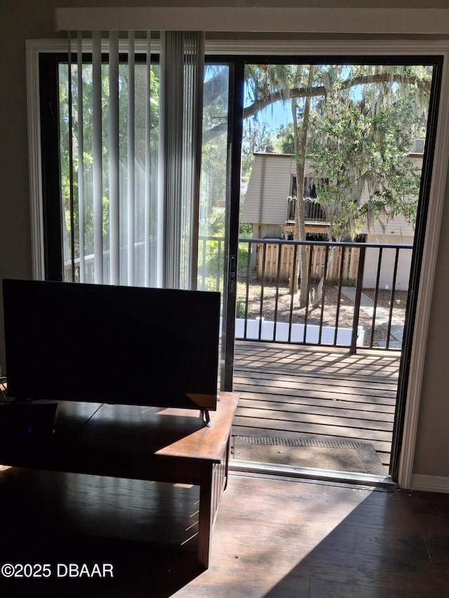 doorway to outside with wood finished floors