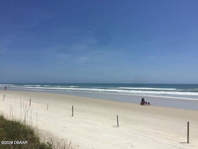 property view of water featuring a beach view