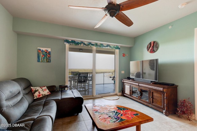 living room featuring light tile patterned floors and ceiling fan