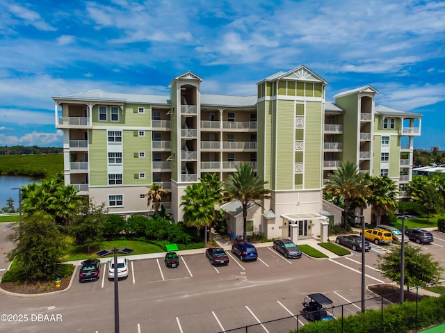 view of building exterior featuring uncovered parking