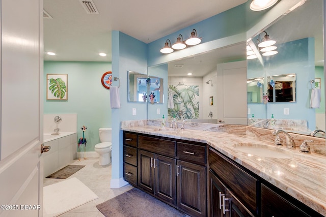 bathroom with double vanity, visible vents, toilet, tile patterned flooring, and a sink