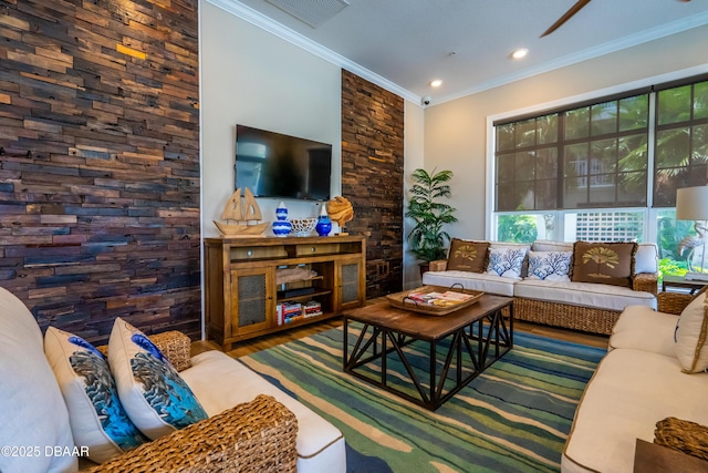 living room featuring ornamental molding, recessed lighting, visible vents, and wood finished floors