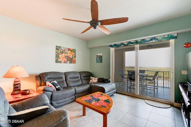 tiled living room featuring a ceiling fan