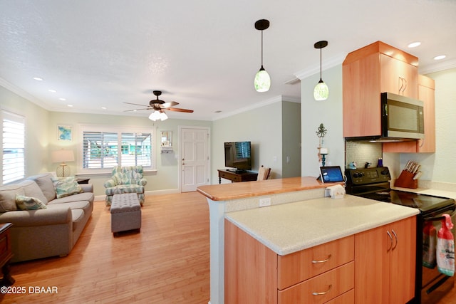 kitchen featuring electric range, ornamental molding, pendant lighting, ceiling fan, and light hardwood / wood-style floors