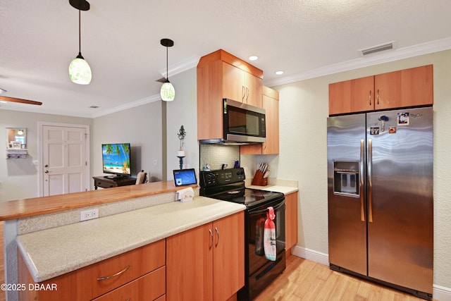 kitchen with stainless steel appliances, ornamental molding, hanging light fixtures, and light hardwood / wood-style floors