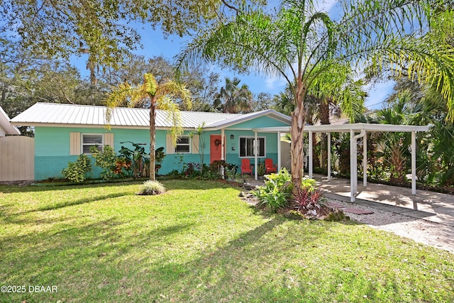 single story home featuring a front lawn and a carport