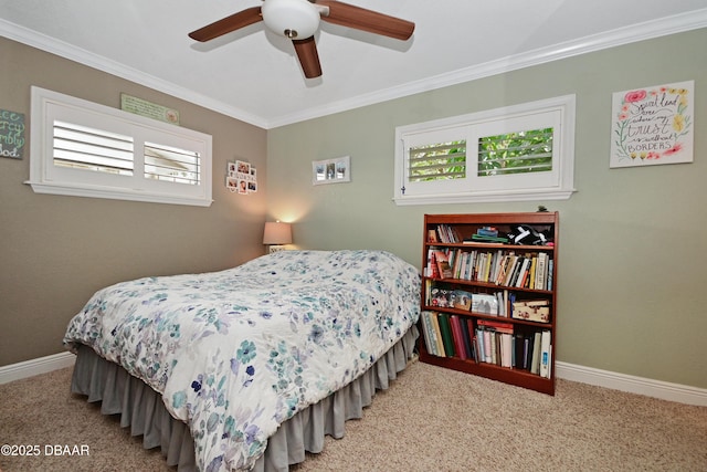 bedroom with carpet floors, ornamental molding, and ceiling fan