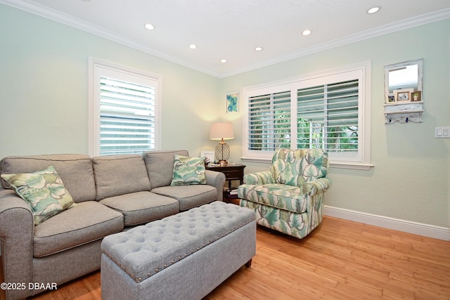 living room featuring ornamental molding and light wood-type flooring