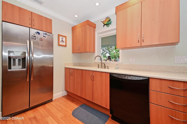 kitchen featuring black dishwasher, sink, stainless steel fridge, crown molding, and light wood-type flooring