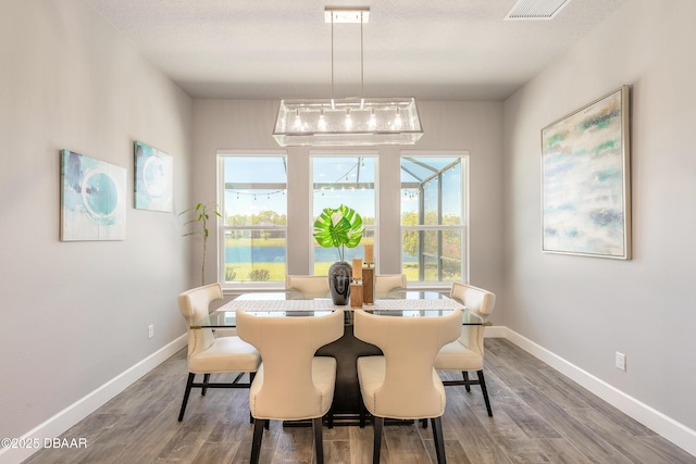 557 Mosaic Blvd, Daytona Beach, FL 32124 - dining room featuring wood finished floors and baseboards