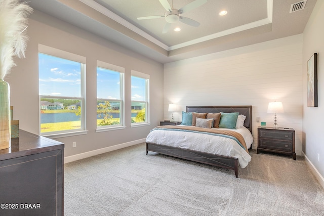 557 Mosaic Blvd, Daytona Beach, FL 32124 - carpeted bedroom featuring baseboards, a water view, recessed lighting, a raised ceiling, and ornamental molding