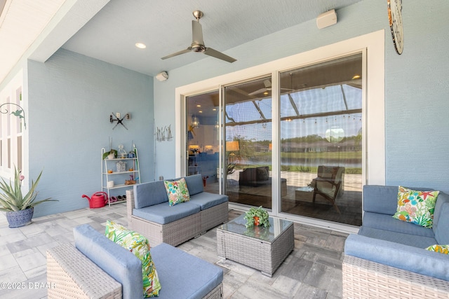 557 Mosaic Blvd, Daytona Beach, FL 32124 - view of patio with ceiling fan, an outdoor hangout area, and a water view