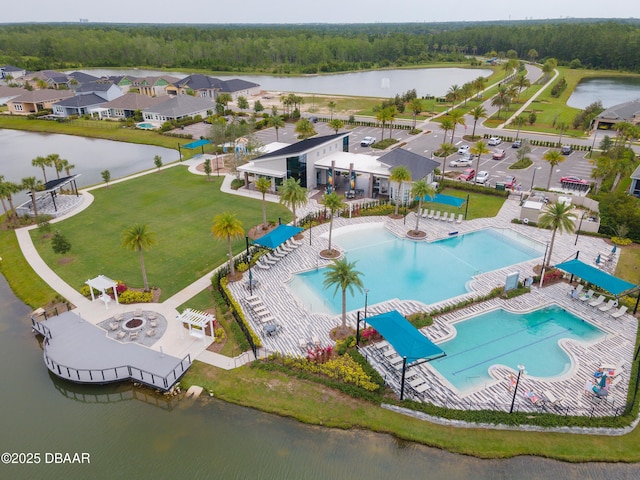 557 Mosaic Blvd, Daytona Beach, FL 32124 - aerial view of a pool, a nearby body of water, and a forest