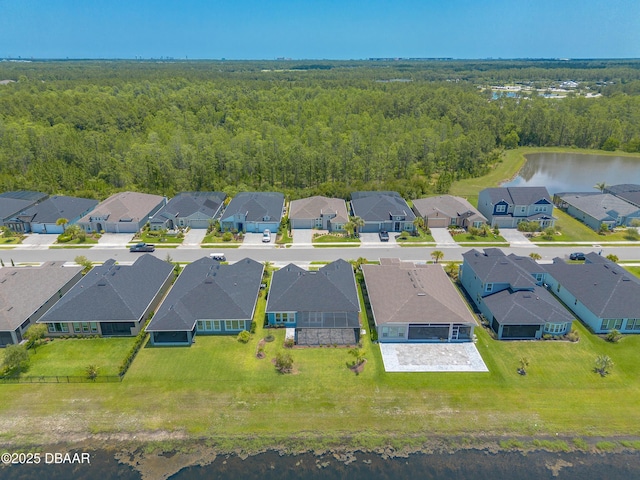 557 Mosaic Blvd, Daytona Beach, FL 32124 - aerial perspective of suburban area with a heavily wooded area and a nearby body of water