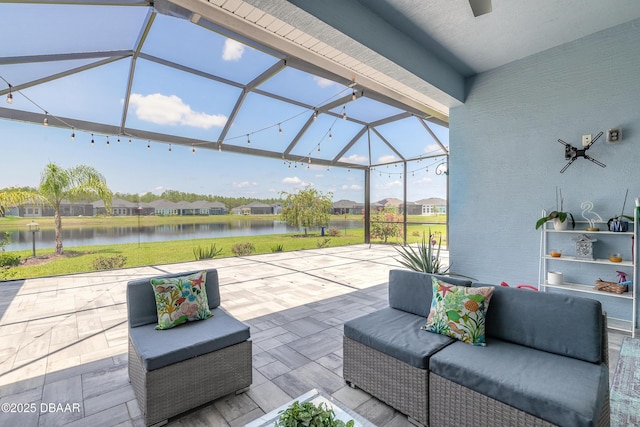 557 Mosaic Blvd, Daytona Beach, FL 32124 - view of patio / terrace with a water view, an outdoor living space, glass enclosure, and a residential view