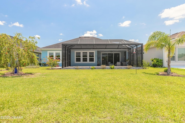 557 Mosaic Blvd, Daytona Beach, FL 32124 - rear view of house with a lawn, glass enclosure, and a patio area