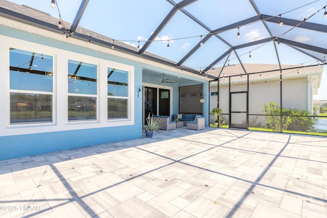557 Mosaic Blvd, Daytona Beach, FL 32124 - view of patio featuring a ceiling fan, outdoor lounge area, and glass enclosure