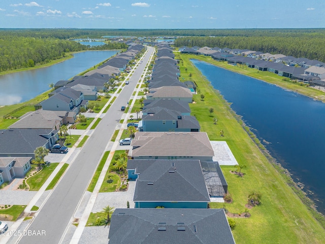 557 Mosaic Blvd, Daytona Beach, FL 32124 - aerial view of residential area with a nearby body of water and a heavily wooded area