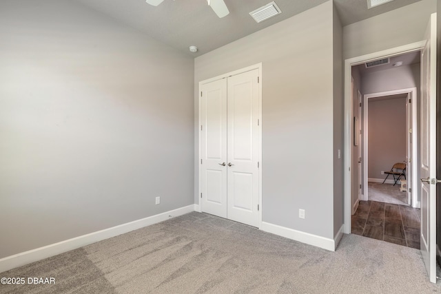 557 Mosaic Blvd, Daytona Beach, FL 32124 - unfurnished bedroom featuring carpet, a closet, baseboards, vaulted ceiling, and ceiling fan