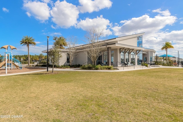 557 Mosaic Blvd, Daytona Beach, FL 32124 - back of house featuring a lawn