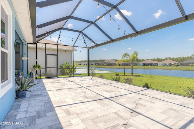 557 Mosaic Blvd, Daytona Beach, FL 32124 - view of patio featuring a water view, a lanai, and a residential view