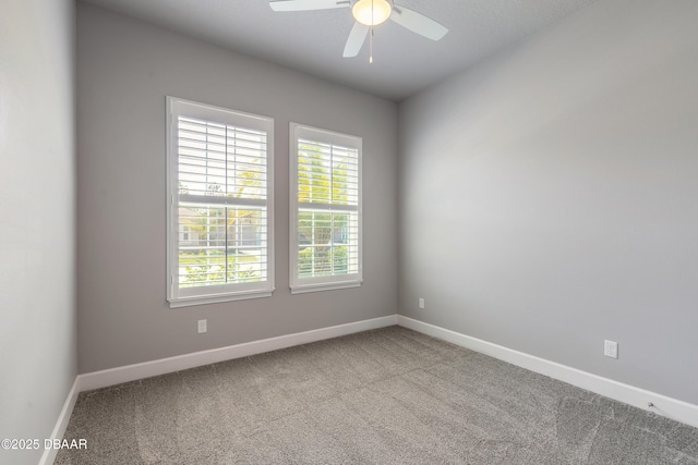 557 Mosaic Blvd, Daytona Beach, FL 32124 - unfurnished room featuring carpet floors, baseboards, and a ceiling fan