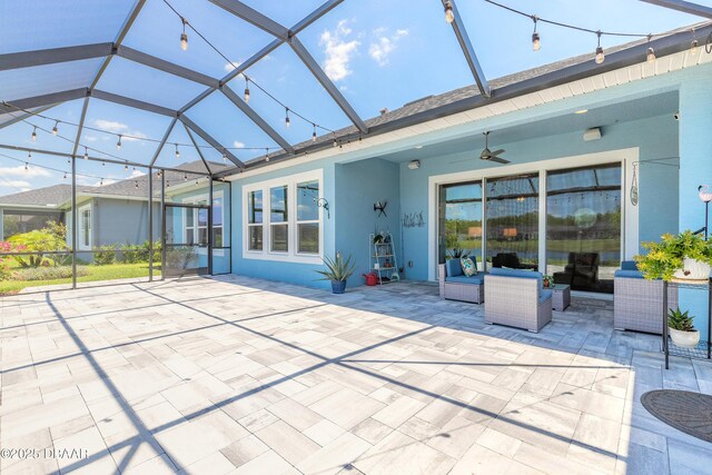 557 Mosaic Blvd, Daytona Beach, FL 32124 - view of patio featuring a ceiling fan, a lanai, and an outdoor living space