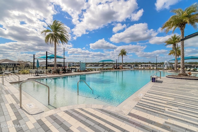 557 Mosaic Blvd, Daytona Beach, FL 32124 - community pool with a patio area