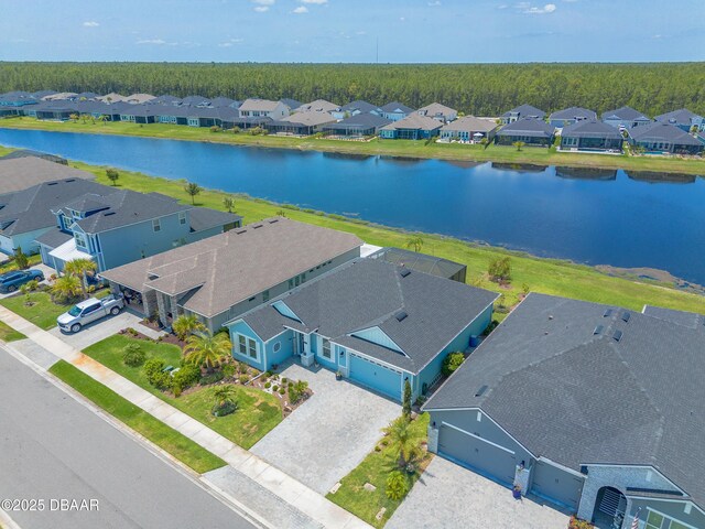 557 Mosaic Blvd, Daytona Beach, FL 32124 - aerial view of residential area featuring a nearby body of water and a heavily wooded area