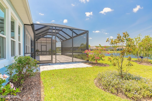 557 Mosaic Blvd, Daytona Beach, FL 32124 - view of grassy yard with a patio and a lanai