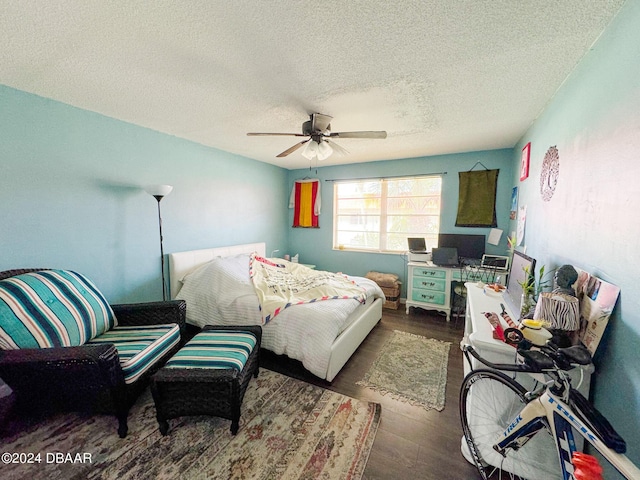 2801 N Halifax Ave Unit 250, Daytona Beach, FL 32118 - bedroom featuring a textured ceiling, wood finished floors, and a ceiling fan