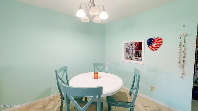 2801 N Halifax Ave Unit 250, Daytona Beach, FL 32118 - dining room with a chandelier and light tile patterned floors