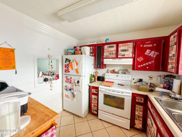 2801 N Halifax Ave Unit 250, Daytona Beach, FL 32118 - kitchen with white appliances, under cabinet range hood, light tile patterned floors, light countertops, and glass insert cabinets