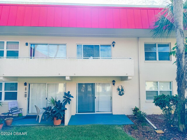 2801 N Halifax Ave Unit 250, Daytona Beach, FL 32118 - view of property featuring stucco siding
