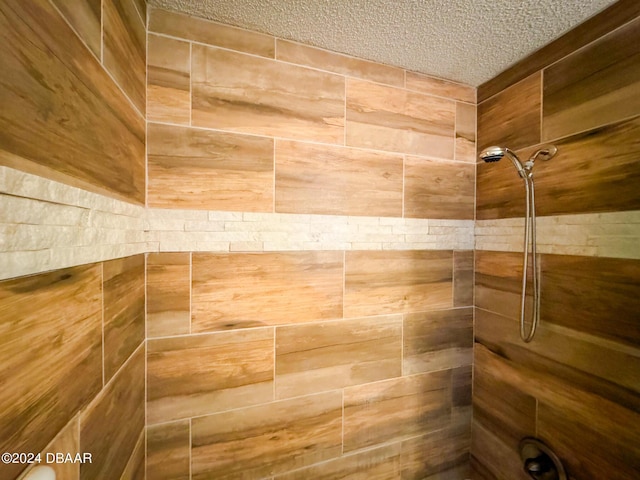 2801 N Halifax Ave Unit 250, Daytona Beach, FL 32118 - bathroom view of tiled shower and a textured ceiling
