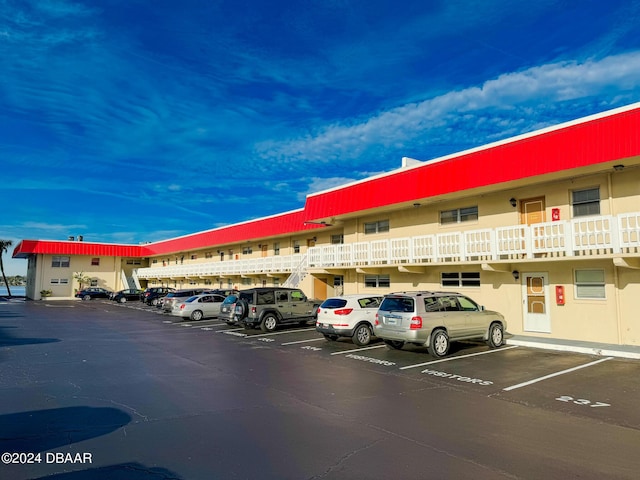 2801 N Halifax Ave Unit 250, Daytona Beach, FL 32118 - view of building exterior with uncovered parking