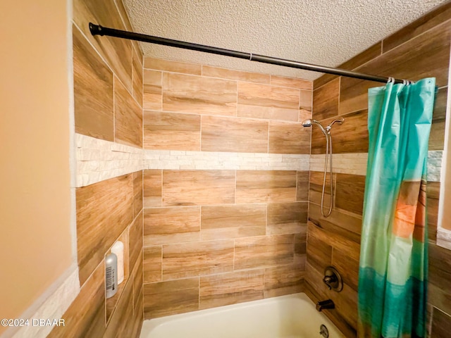 2801 N Halifax Ave Unit 250, Daytona Beach, FL 32118 - bathroom with shower / bath combination with curtain and a textured ceiling