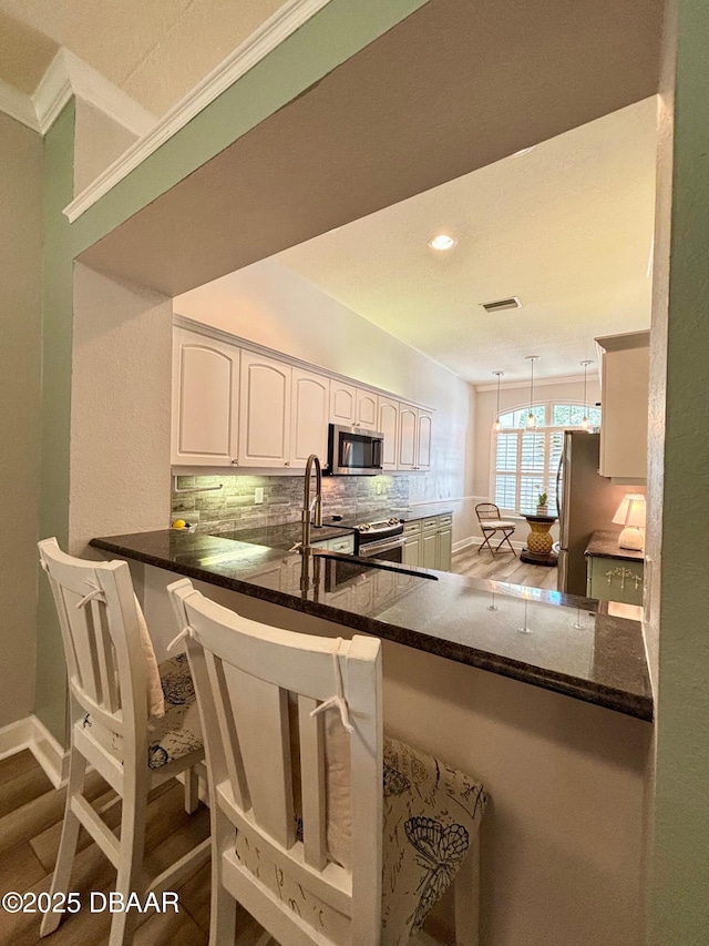 1455 Carlow Cir, Ormond Beach, FL 32174 - full bath featuring wood finished floors, double vanity, and baseboards