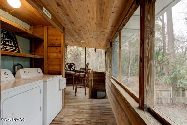 washroom with wooden ceiling, independent washer and dryer, and light hardwood / wood-style floors