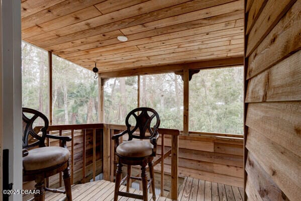 sunroom / solarium featuring wooden ceiling